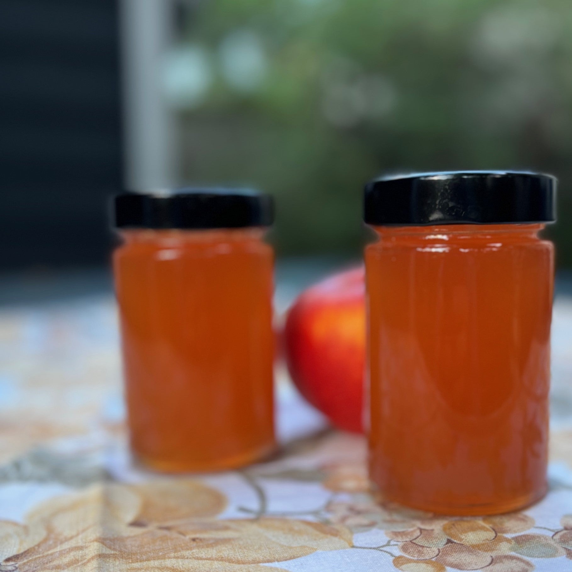 Two jars of apple jelly