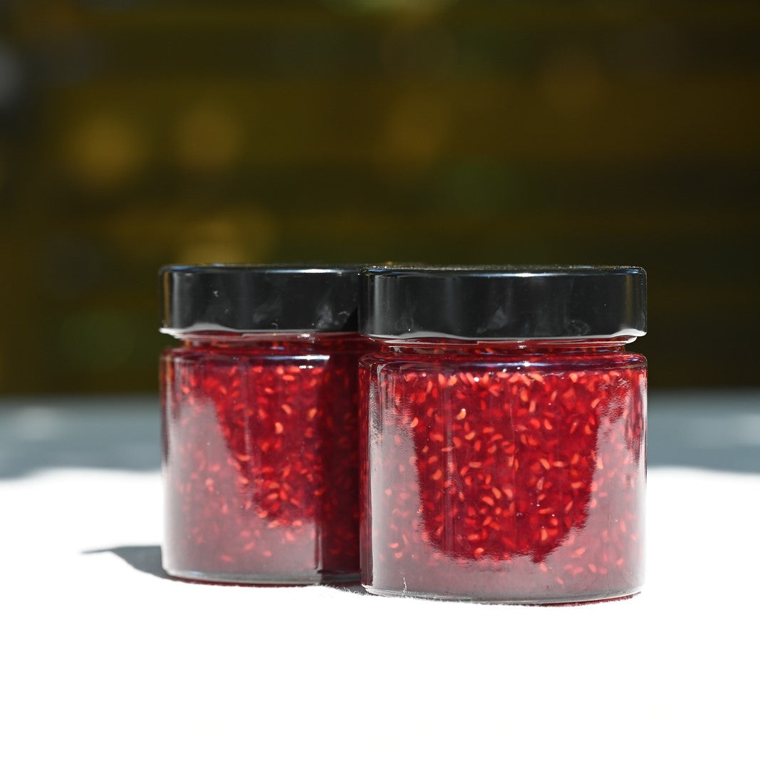 Two jars of raspberry jam