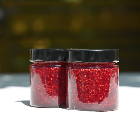 Two jars of raspberry jam