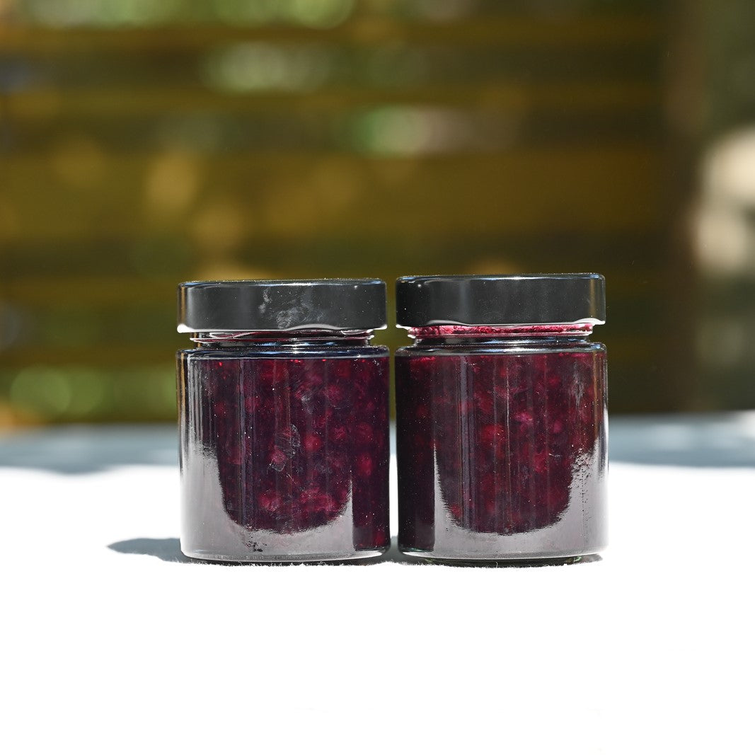 Two jars of wild blueberry and gin jam