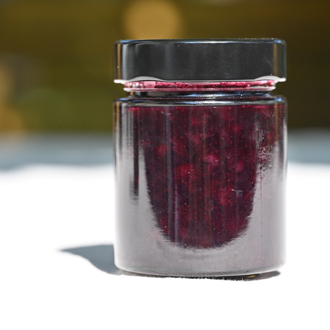 A jar of wild blueberry and gin jam