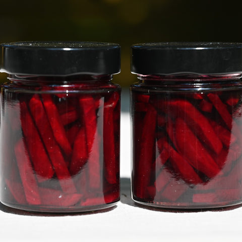 Close up of two jars of pickled beets