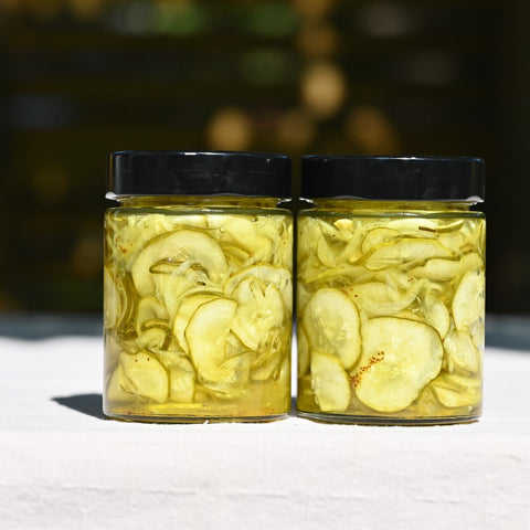 Two jars of bread and butter pickles