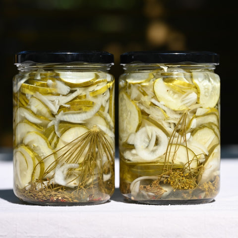 Two jars of sliced dill pickles 