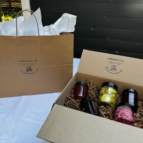 Five products that are part of the Charcuterie Collection in a  box