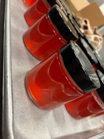 Jars of Apple and Hibiscus Tea Jelly right out of the processing steamer