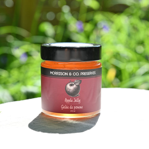 Jar of Morrison & Co Preserves Apple Jelly with a blurred green background